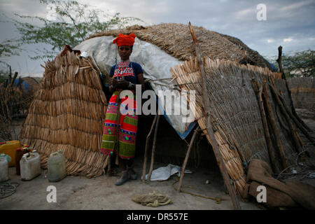 Ethiopian nomad family with their hut and animals Stock Photo