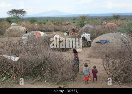 Ethiopian nomad family with their hut and animals Stock Photo