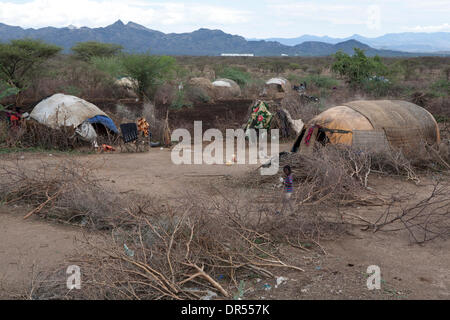 Ethiopian nomad family with their hut and animals Stock Photo