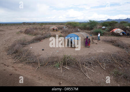 Ethiopian nomad family with their hut and animals Stock Photo