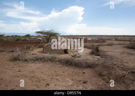 Ethiopian nomad family with their hut and animals Stock Photo