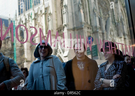 Apr 23, 2009 - New York, New York, USA - A crowd lines up outside of the Fifth Avenue Hennes & Mauritz store in Manhattan awaiting the launch of British designer Matthew Williamson's line of women's clothes designed exclusively for H&M, on Thursday, April 23, 2009. Only three H&M stores in New York will carry the line, and the designer plans to release a line of men's clothing for  Stock Photo