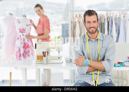 Portrait of man with female fashion designer working at studio Stock Photo