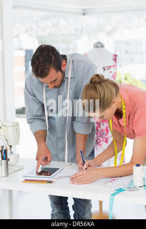 Fashion designers at work in bright studio Stock Photo