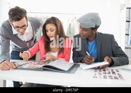 Fashion designers discussing designs Stock Photo