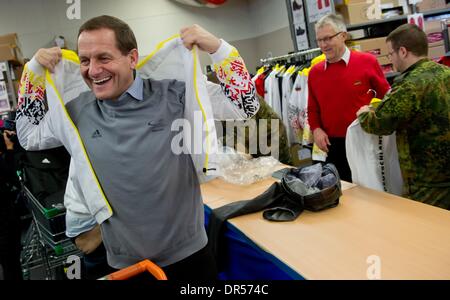 Erding, Germany. 20th Jan, 2014. Alfons Hoermann (L), president of the German Olympic Sports Confederation DOSB, receives his outfit during the official kitting out of the Olympic team for the Olympic Winter Games in Sochi 2014 in Erding, Germany, 20 January 2014. Photo: Sven Hoppe/dpa/Alamy Live News Stock Photo