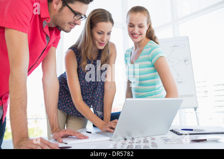 Casual business people using laptop in office Stock Photo