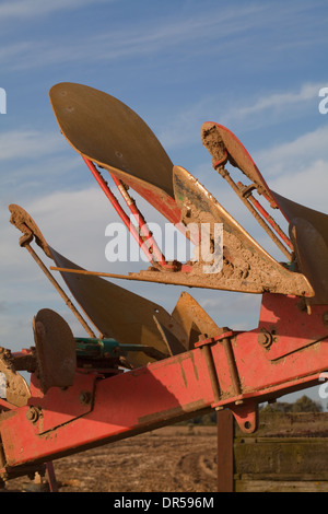 Plough shares. Kverneland RX 100. Tractor drawn agricultural machinery, used to turn soil after harvesting. Stock Photo