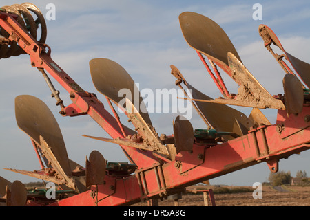 Plough shares. Kverneland RX 100. Tractor drawn agricultural machinery, used to turn soil after harvesting. Stock Photo