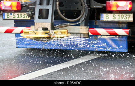 Berlin, Germany. 20th Jan, 2014. A vehicle of the snow and ice control salts a street in Berlin, Germany, 20 January 2014. With temperatures beneath zero degrees Celsius many streets in the city are covered with a layer of ice. Photo: Ole Spata/dpa/Alamy Live News