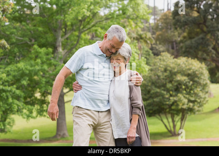 Happy senior couple embracing in park Stock Photo