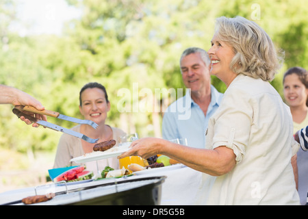 Extended family dining at outdoor table Stock Photo
