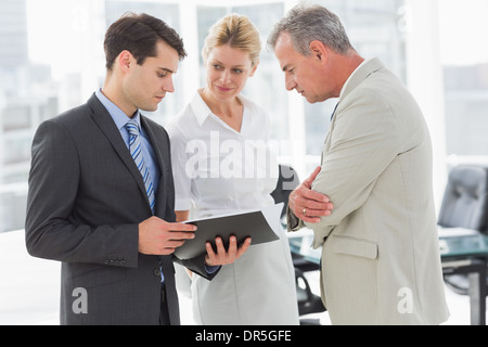 Business team going over documents Stock Photo