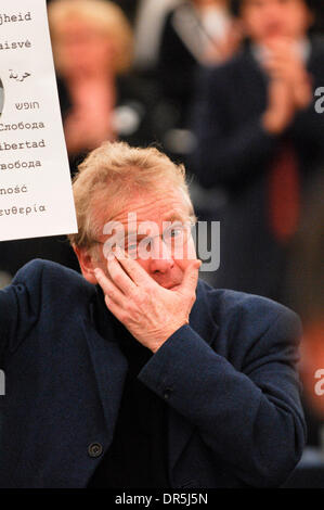Dec 17, 2008 - Strasbourg, France - GREENS/EFA Parliamentary group Co-President DANIEL COHN-BENDIT cries when wife of dissident Hu Jia talks during the awards ceremony of the Sakharov Prize 2008 at the European Parliament in the northeastern French city of Strasbourg. The prize was awarded in absentia to jailed Chinese dissident Hu Jia, whose nomination deeply angered Beijing. The  Stock Photo