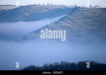 Ashbourne, Peak Districk, UK . 20th Jan, 2014. Freezing mist clings to the steep slopes surrounding Dovedale near Ashbourne in The Derbyshire Peak District today. Credit:  Joanne Roberts/Alamy Live News