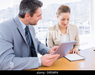 Smartly dressed colleagues in business meeting Stock Photo