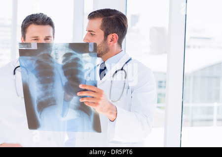 Two male doctors examining x-ray Stock Photo