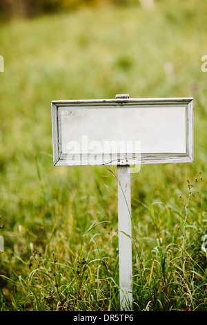 Blank sign board on a field Stock Photo