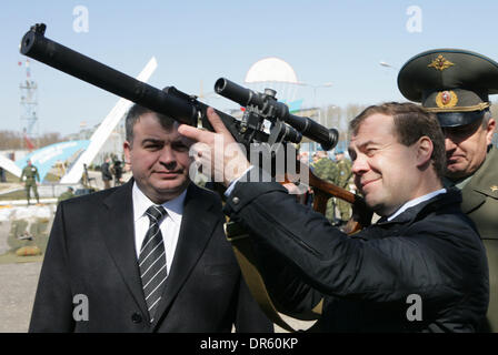 Apr 22, 2009 - Ryazan, Russia - President of Russia DMITRY MEDVEDEV checks out a sniper rifle while Russian Defense Minister ANATOLY SERDYUKOV (L) look on during a visit to Ryazan paratrooper military academy. (Credit Image: © PhotoXpress/ZUMA Press) Stock Photo