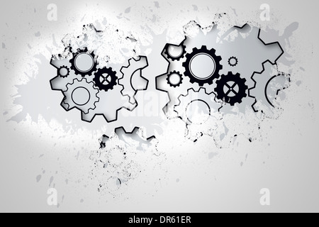 Splash on wall revealing cogs and wheels Stock Photo