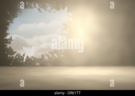 Splash on wall revealing bright sky Stock Photo