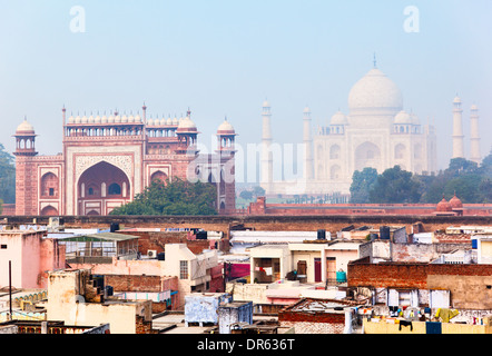 Residential quarter in Agra with Great gate (Darwaza-i rauza) and Taj Mahal as a backdrop Stock Photo