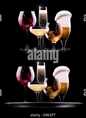 tray with different drinks on black background - champagne, beer, cocktail, wine, brandy, whiskey, scotch, vodka, cognac Stock Photo