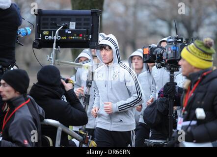 Munich, Germany. 20th Jan, 2014. German National Football Coach Joachim LOEW (Löw) runs in front of a cameraman during the filming for commercial reasons while the national football team spends a day for marketing activitates in Munich,Germany Credit:  norbert schmidt/Alamy Live News Stock Photo