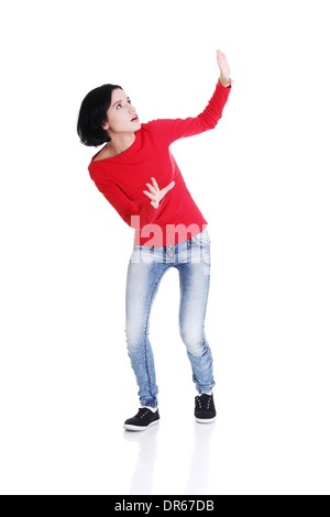 Scared woman defending herself, isolated on white background  Stock Photo