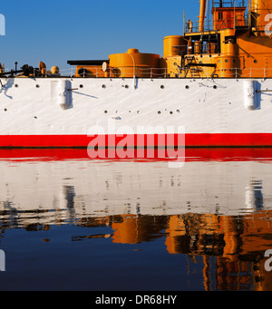 The USS Olympia stands reflective and graceful in the still waters of Penn’s Landing, City of Philadelphia Stock Photo