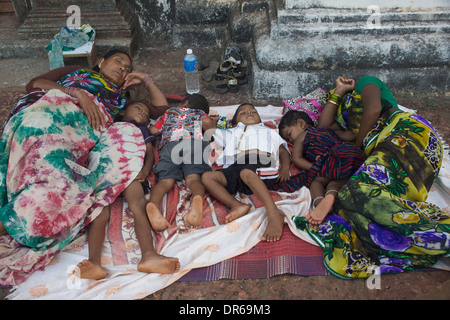 Family asleep outside Sé Catedral de Santa Catarina in Goa, India Stock Photo