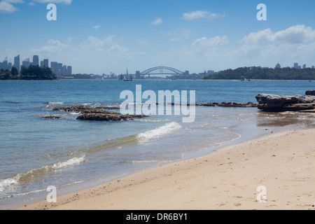 Milk Beach with Sydney Harbour Bridge and city skyline in background Sydney New South Wales NSW Australia Stock Photo