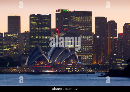 Sydney Opera House and skyline of CBD at sunset night from Cremorne Point Sydney New South Wales NSW Australia Stock Photo