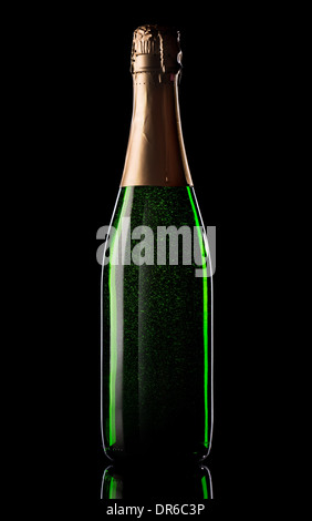 Green bottle of champagne on black background Stock Photo