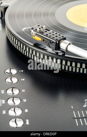 Phonograph cartridge waits over turntable Stock Photo