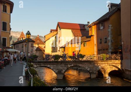 A bridge across the river Thiou in the old town of Annecy, France, at sunset Stock Photo