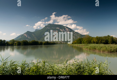 Reflection of a mountain and clouds in the river Rhone near Chanaz in France, taken from the ViaRhôna cycle path Stock Photo