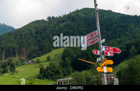 Signposts for Swiss national long distance and regional cycle routes in Schwanden, Glarus, in the Swiss Alps Stock Photo