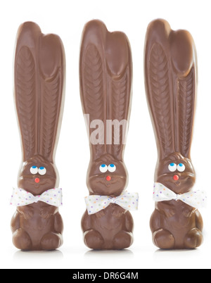 Group of three chocolate bunnies with polka dot bow ties isolated on white Stock Photo