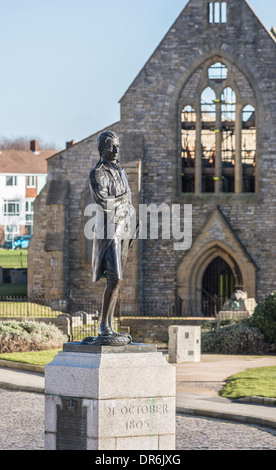 Statue of Admiral Lord Nelson, hero of Battle of Trafalgar, in Grand Parade, Portsmouth, in front of Royal Garrison Church Stock Photo
