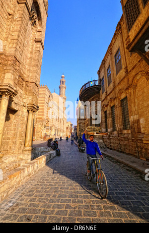 Bike Rider in old Cairo street (Working Early) Stock Photo