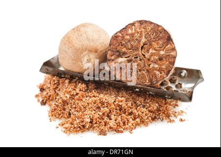 whole and grated nutmeg on white background Stock Photo