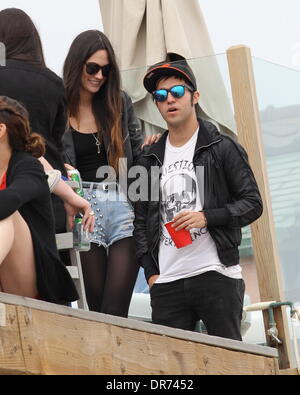 Pete Wentz and his girlfriend Meagan Camper attend an Independence Day house party on Malibu beach Los Angeles, California - 04.07.12 Stock Photo