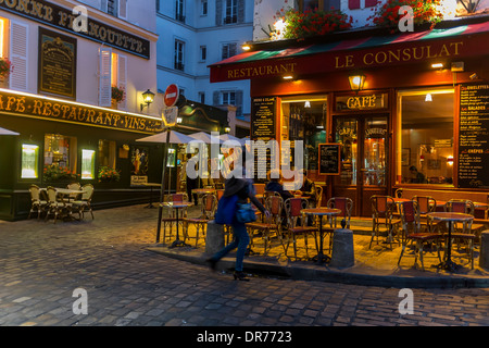 dusk in montmartre paris france.restaurants cafes montmartre paris.narrow streets in paris 18th arrondissement. Stock Photo