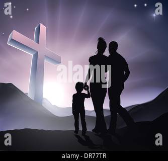 A Christian family with a cross in a mountain landscape and a sunrise, Christian family life or Easter concept Stock Photo