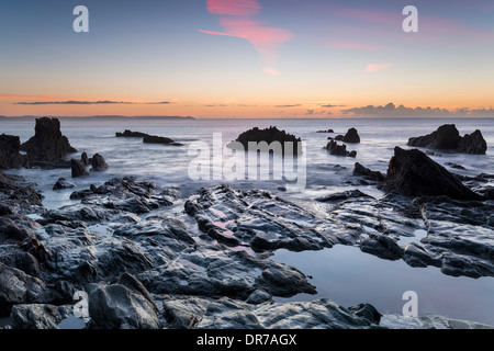 Sunrise at the beach at Looe on the south coast of Cornwall Stock Photo