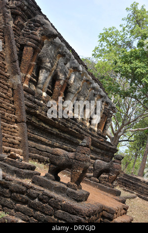 Carvings adorn palace ruins at the Kamphaeng Phet Historical Park in Thailand. Stock Photo