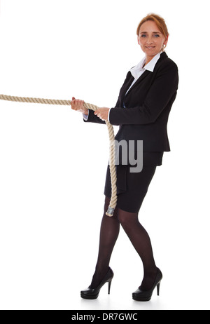 Businesswoman pulling rope. All on white background. Stock Photo