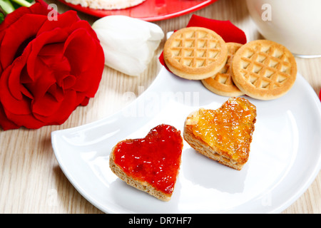 a sweet breackfast with love and red hearths of jam Stock Photo - Alamy