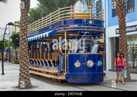 Streetcar conductor directs tourists in Oranjestad Aruba Stock Photo